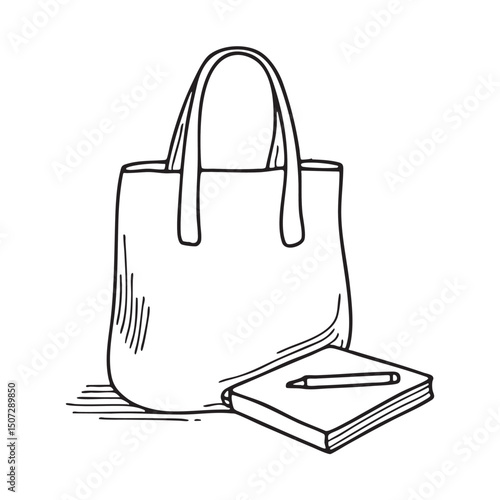 A tote bag resting beside a sketchpad and markers