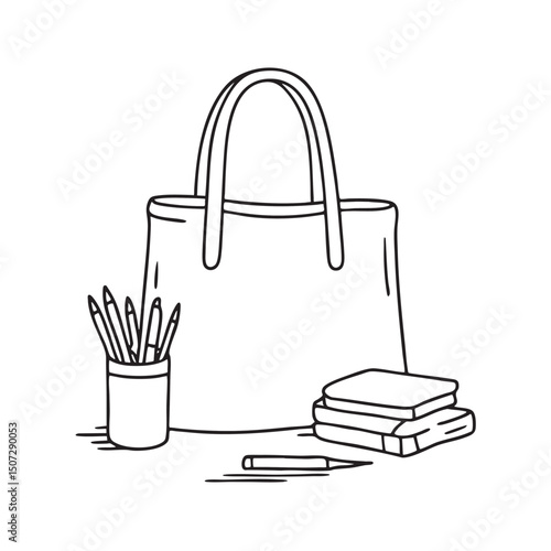 A tote bag resting beside a sketchpad