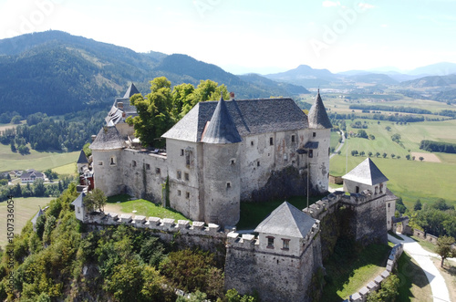 Bilde på lerret Aerial view of a medieval Hochosterwitz castle and church tower in the Austrian Alps