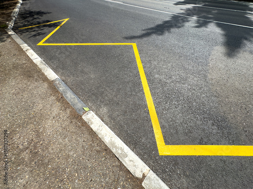 Wallpaper Mural A yellow line is painted on the road, separating the road from the sidewalk Torontodigital.ca