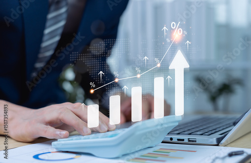 Businessman using calculator with percentage graph symbol and up arrow. Dividends and long term investment to beat inflation. Investment growth and profit. Interest rate and tax calculation concept.
