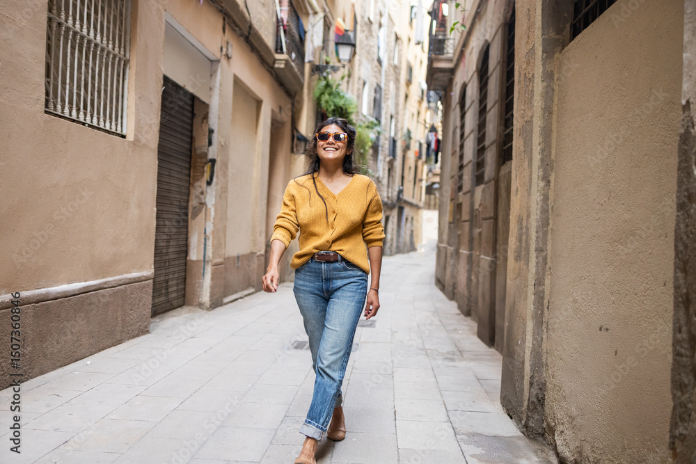 Woman walking in vibrant city street Woman walking in vibrant city street