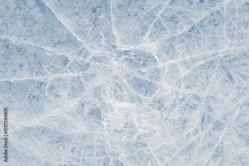 Crystalized ice background texture with cracks in a web-style in a light-blue tone.