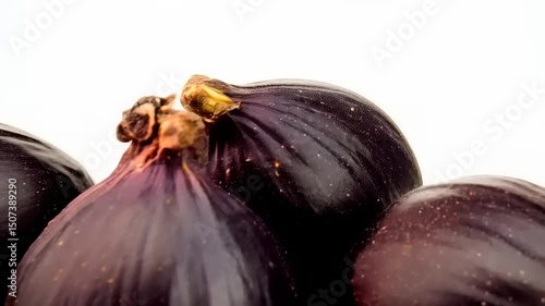 Wallpaper Mural Four dark figs are presented against a plain background creating visual appeal Torontodigital.ca