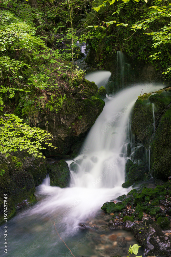 Naklejka premium Long exposure picture in a beautiful waterfall called Surjentziak in Arantzazu (Oñati - Basque Country)