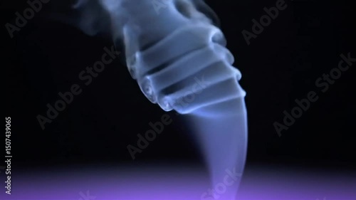 A mesmerizing smoke design emerges from a pitch black background, shrouded in an ombre gradient of light blue, gradually deepening into dark blue and finally surrendering to the mystery of the darknes