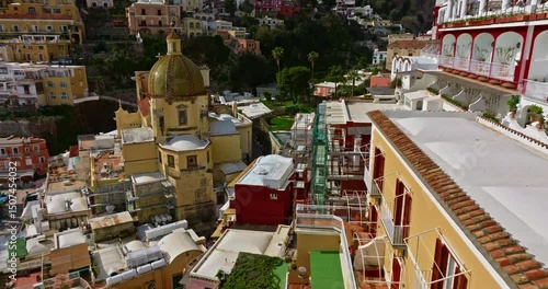 Aerial view of Positano. Marina Grande beach, town hall, Sant'Andrea duomo bell tower in Amalfi coast, Italy