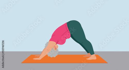Senior woman practicing downward dog yoga pose on orange mat in calm indoor setting with blue background 