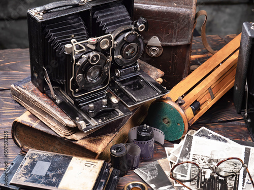 Collection of old cameras, on wooden background.