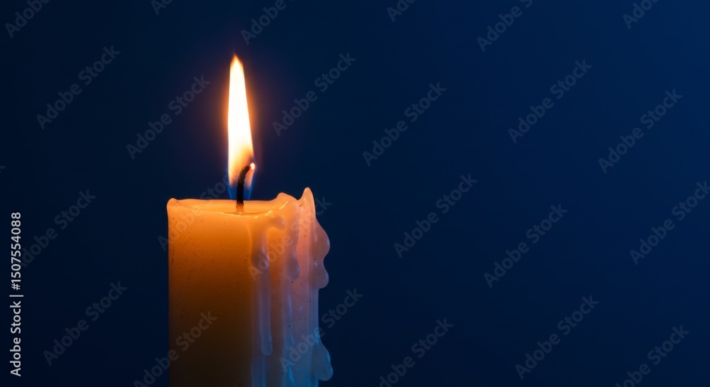 Fototapeta premium Solitary candle flame in tranquil atmosphere, symbol of hope and serenity