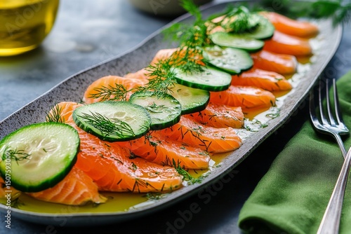 Fresh Salmon and Cucumber Salad Served on a Black Platter With Herbs at a Sty...