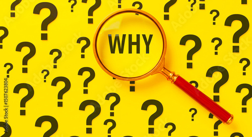 A magnifying glass over the word why surrounded by question marks on a yellow background surface
