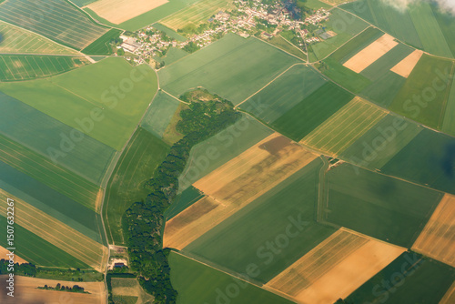 Aerial View of farmland landscape for agricultural planning and rural development. Useful for illustrating crop distribution and land management concepts.