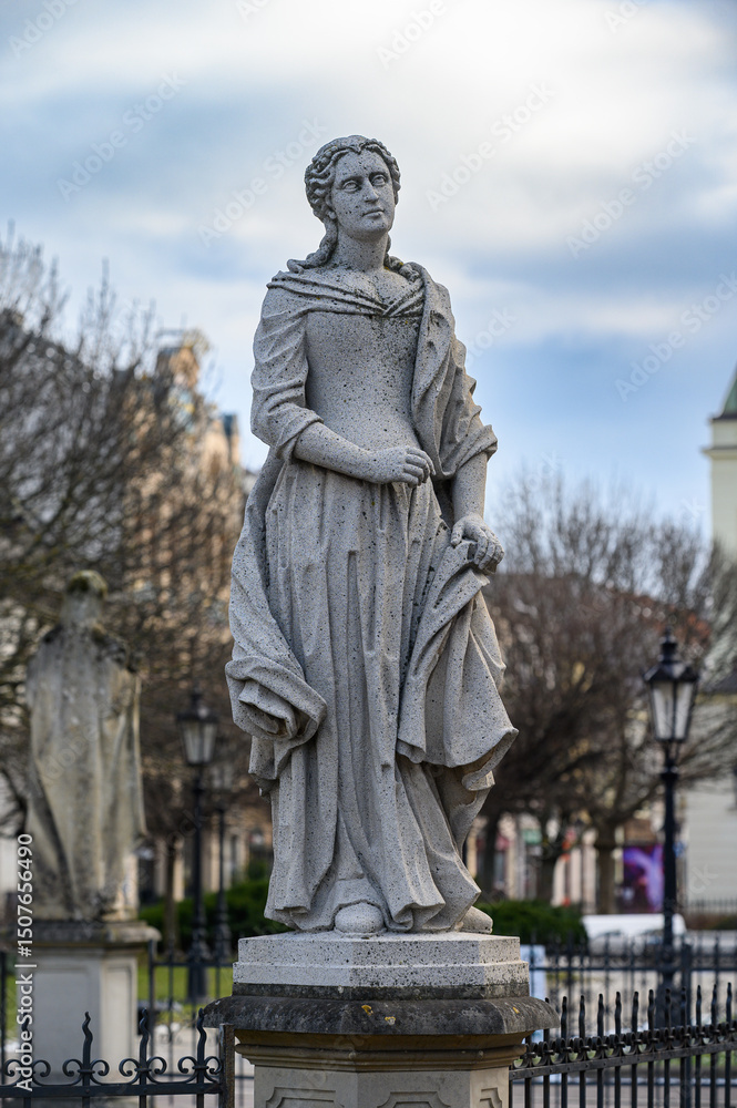 Fototapeta premium A statue of a saint (St Elizabeth of Portugal?) at the Plague Column dedicated to the Immaculate Virgin Mary in Košice, Slovakia.