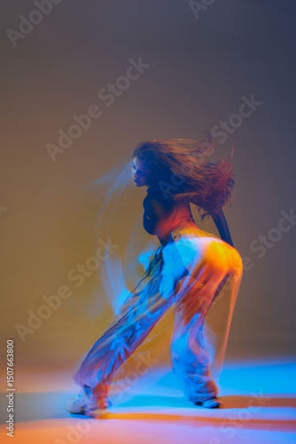 Photography Energetic dancers in vibrant attire performing jazz-funk choreography in a modern studio, showcasing dynamic movements, expressive poses, and synchronized group formations