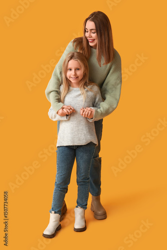 Cute little girl and her mo...