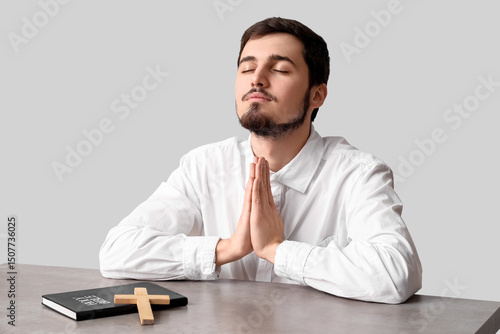 Religious young man praying...
