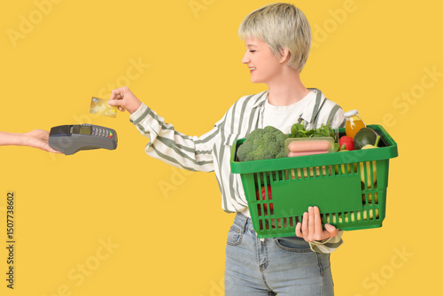 Young woman with full shopp...