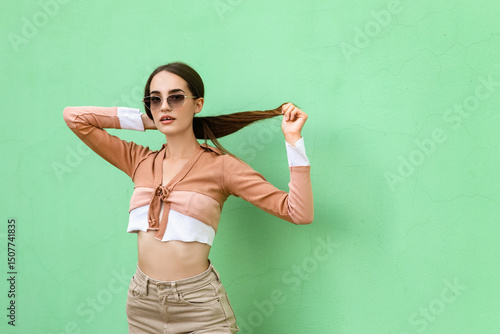 Beautiful young woman in st...