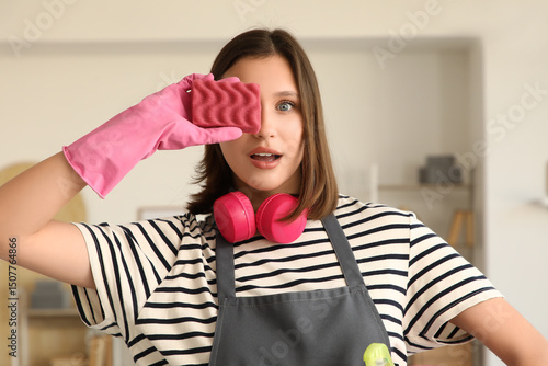 Surprised female janitor wi...