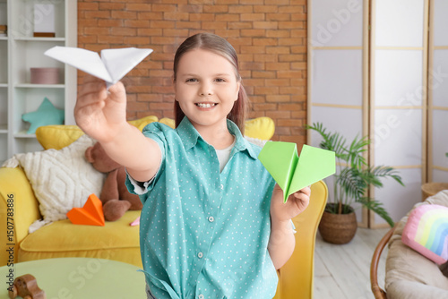 Cute girl with paper planes...