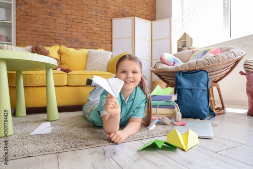Cute girl with paper planes...