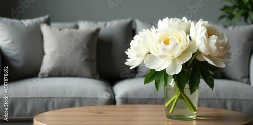 Fototapeta Naklejka Na Ścianę i Meble -  White peonies in vase on coffee table, grey sofa background, living room, scandinavian, bloom