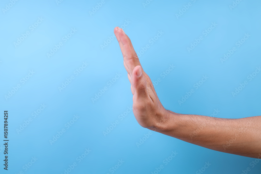 Woman Hand Showing Stop Gesture Isolated On Blue Background Woman Hand Showing Stop Gesture Isolated On Blue Background