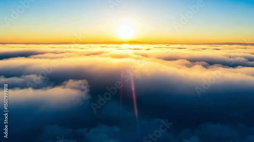Airplane window view A serene sunrise breaks through soft clouds, illuminating the sky with vibrant colors of dawn, creating a peaceful scene.
