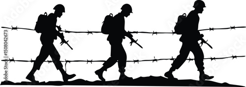 Silhouette of soldiers carrying rifles walks along a barbed wire fence, showing their bravery and determination