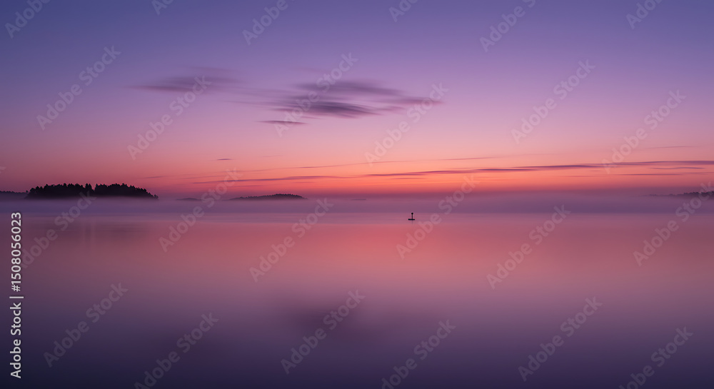 Fototapeta premium Serene Sunset over Misty Lake with Silhouetted Islands and Calm Waters