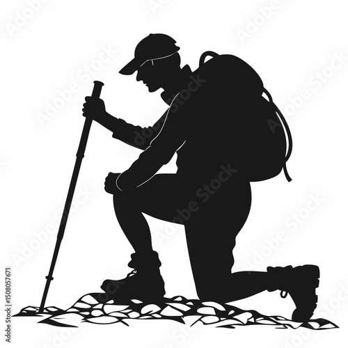 black silhouette of a hiker resting on one knee with one hand holding a trekking pole