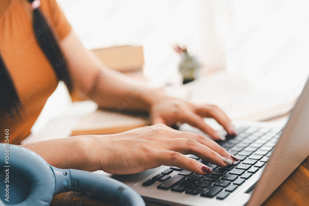 woman sitting at desk working on laptop taking notes in notebook, female studying online, watching webinar using computer, writing check list. Remote college school education, e learning concept. woman sitting at desk working on laptop taking notes in notebook, female studying online, watching webinar using computer, writing check list. Remote college school education, e learning concept.