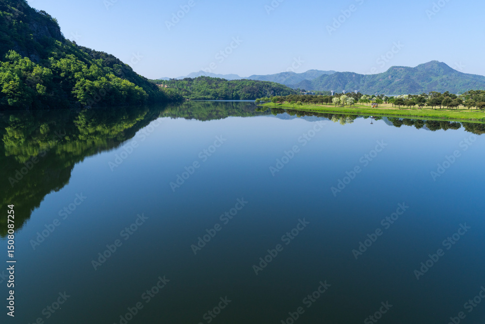 View of the calm lake on a sunny day View of the calm lake on a sunny day