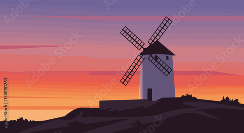 Windmill silhouette against colorful sunset sky over hill  