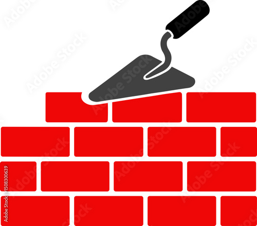 Red bricks being laid with trowel in construction process  