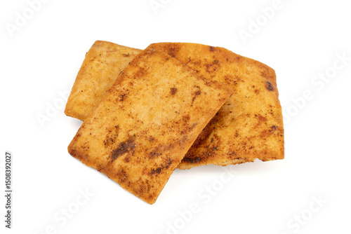 Nacho chips texture. Tortilla chips. Taco chips. Close-up. Food background. Tasty snack. Group of crispy corn chips isolated on white background.