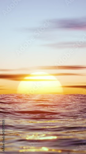 Big hot sun in the reflection of the sea over the horizon. Vertical looped video