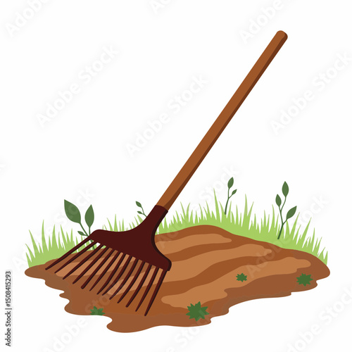 Vintage metal rake in garden plot, symbolizing durability and purpose
