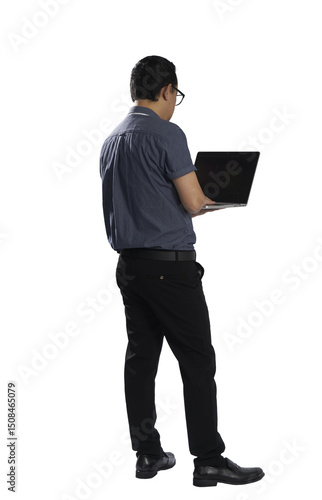 Businessman standing and typing on laptop with transparent background