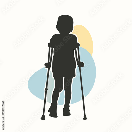 Young boy walking with crutches silhouette.