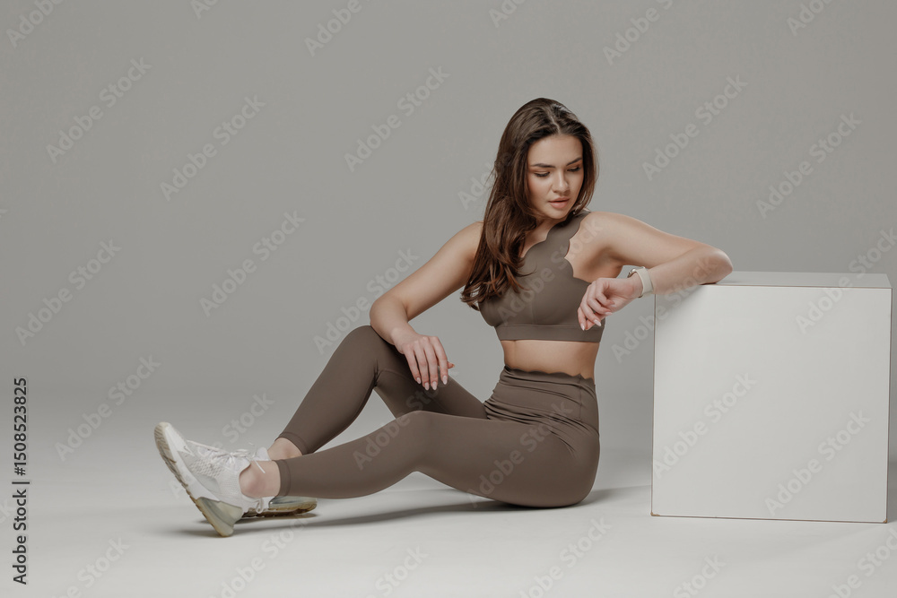 custom made wallpaper toronto digitalFocused woman engaging in fitness routine at a modern studio during a professional photoshoot