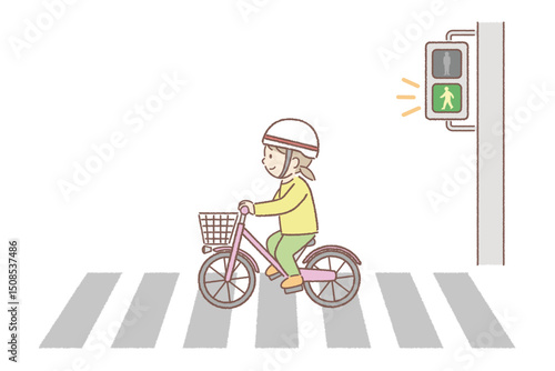 横断歩道を自転車で渡る女の子
