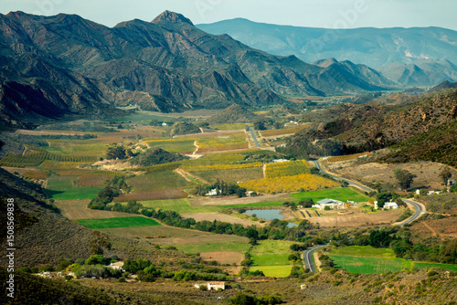 View from the Burger Pass of the Kiesie valley an 18km long valley which is enclosed by the Langeberg mountains. Apricots, peaches and vines are grown here. 
