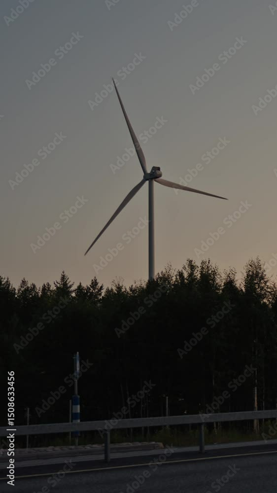 VERTICAL VIDEO: Silhouette of an electric windmill with rotating blades at sunset. Sustainable energy concept. An environmentally friendly farm energy resource. Renewable source of electricity Finland VERTICAL VIDEO: Silhouette of an electric windmill with rotating blades at sunset. Sustainable energy concept. An environmentally friendly farm energy resource. Renewable source of electricity Finland