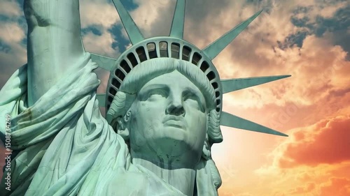 Statue of Liberty holding a torch and a tablet with a cloudy sky in the background