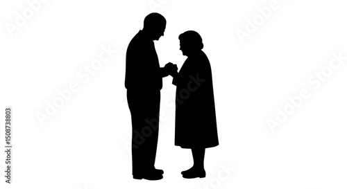 Elderly couple holding hands while standing together in silhouette  
