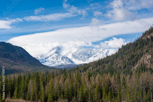 Snow-covered Akturu ridge visible from valley near Aktash Altai Russia.
