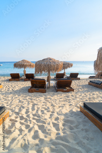 Fototapeta Naklejka Na Ścianę i Meble -  summer beach with sunbeds, Mykonos island, Greece