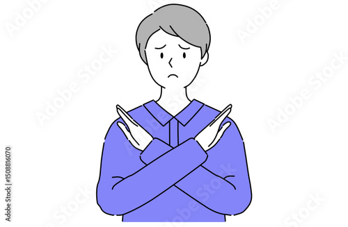 胸の前で腕を交差してバツ印を作っている若い男性